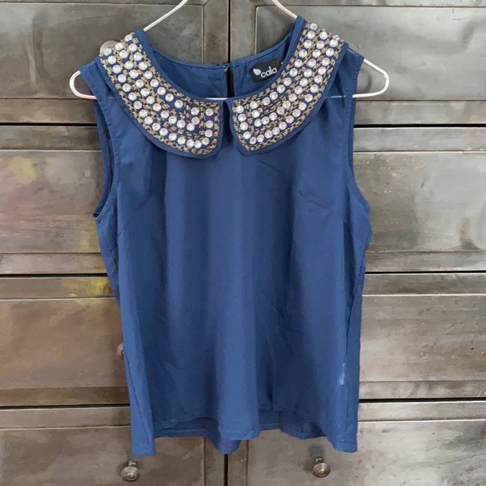 Sheer blue sleeveless top with gold and silver beaded collar